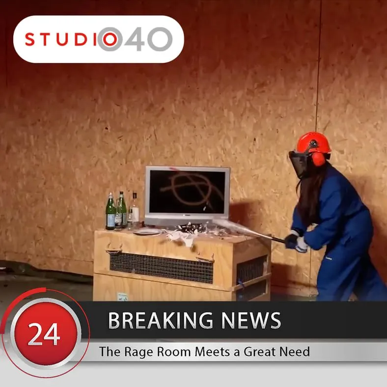 Studio 040 news item showing a woman in safety gear smashing a TV at The Rage Room Eindhoven